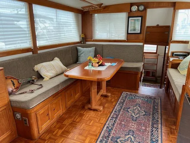 Slide: The Image of Interior of 1969 Grand Banks 42 Classic yacht with cozy seating and wooden table. - 49
