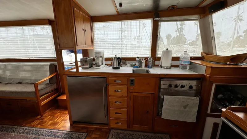 Slide: The Image of Interior of 1969 Grand Banks 42 Classic yacht with wooden cabinetry and kitchen appliances. - 7