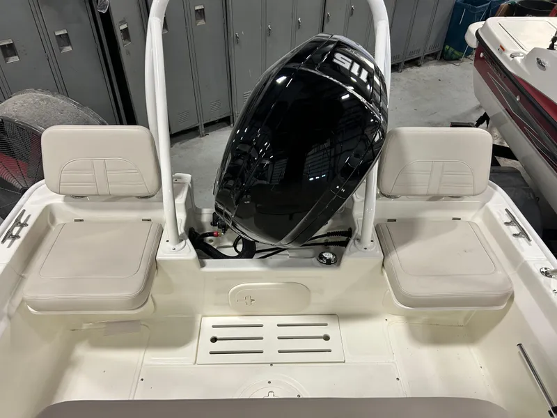 Slide: The Image of 2024 Boston Whaler 170 Montauk boat interior with outboard motor. - 4