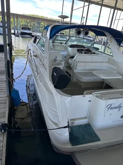Slide: The Image of 1997 Sea Ray 330 Sundancer docked in a marina. - 10