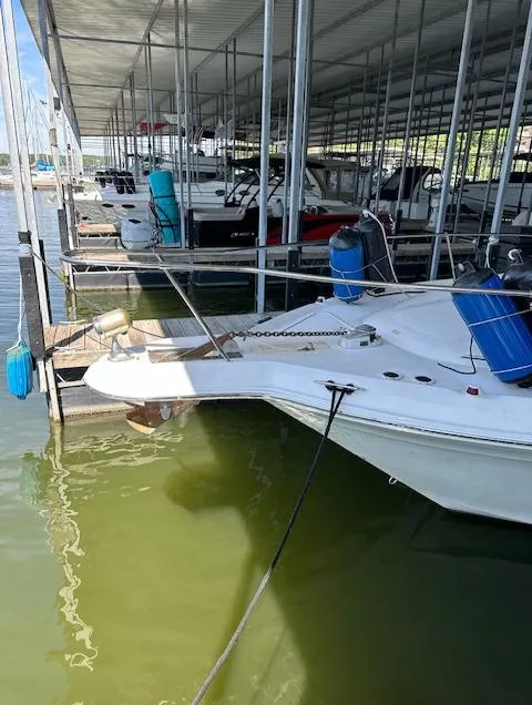 Slide: The Image of 1997 Sea Ray 330 Sundancer docked in a marina. - 13
