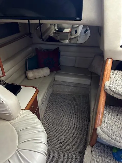 Slide: The Image of Interior cabin of a 1997 Sea Ray 330 Sundancer yacht with seating and stairs. - 6