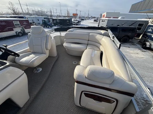 Slide: The Image of 2008 Sun Tracker PARTY BARGE 22 Regency Edition with plush seating in a snowy lot. - 14