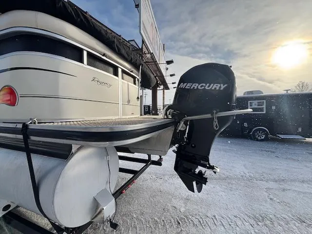 Slide: The Image of 2008 Sun Tracker PARTY BARGE 22 with Mercury outboard motor in snowy setting. - 22