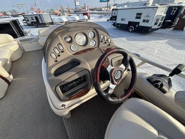 Slide: The Image of 2008 Sun Tracker PARTY BARGE 22 Regency Edition boat dashboard in snowy setting. - 7