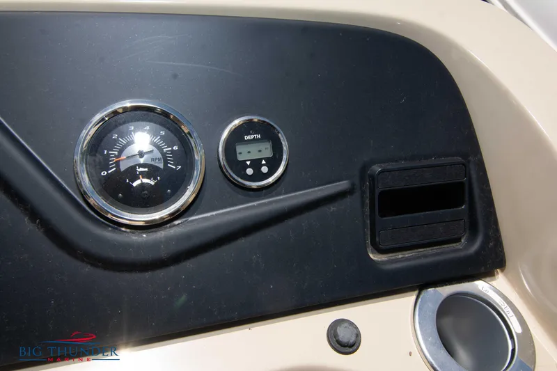 Slide: The Image of Dashboard of 2023 Crest CLASSIC LX 240 SLC boat with fuel gauge and digital display. - 18