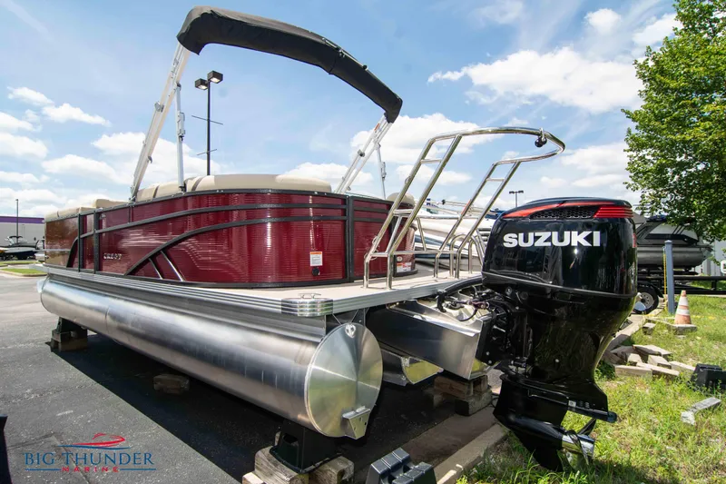 Slide: The Image of 2023 Crest CLASSIC LX 240 SLC pontoon boat with Suzuki outboard motor. - 2