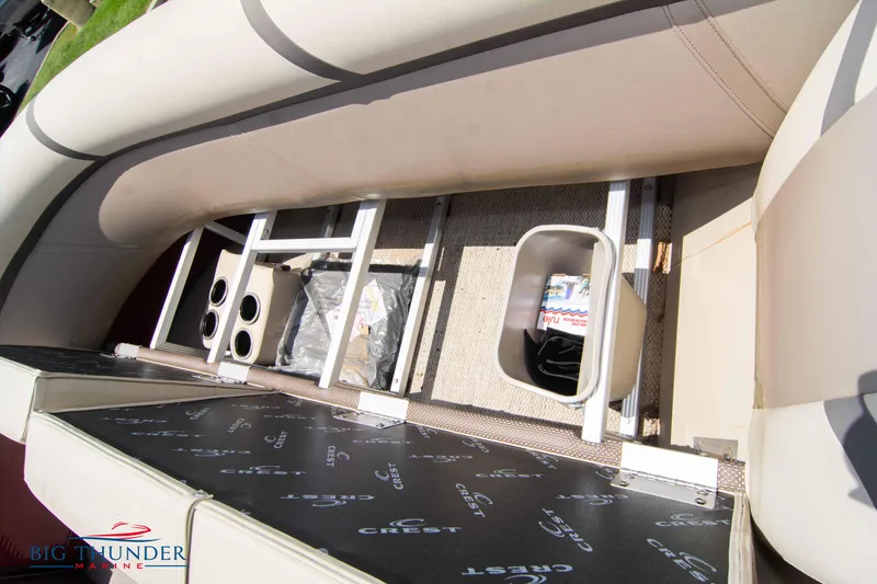 Slide: The Image of 2023 Crest CLASSIC LX 240 SLC boat interior storage compartments. - 35