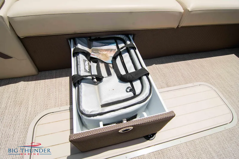 Slide: The Image of 2023 Crest CLASSIC LX 240 SLC boat storage compartment with cooler. - 8