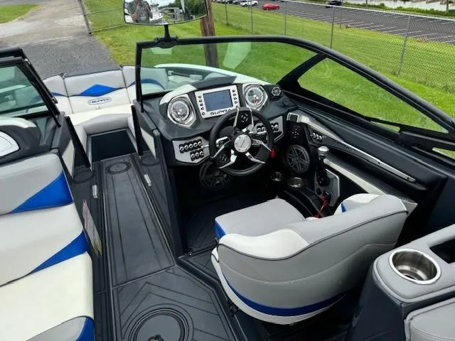 Slide: The Image of 2018 Supra SE boat interior with modern dashboard and seating. - 4