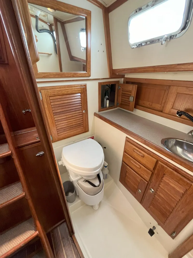 Slide: The Image of Interior of a 1998 Pacific Seacraft 40 yacht with wooden cabinetry. - 15