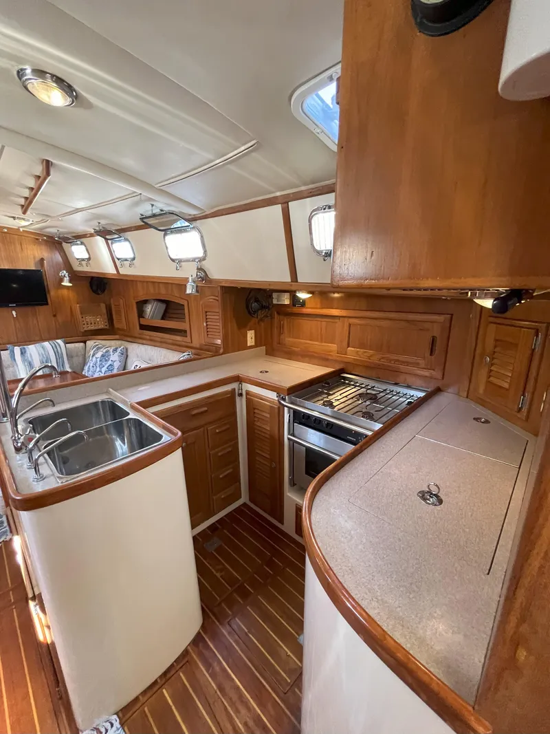Slide: The Image of Interior of a 1998 Pacific Seacraft 40 yacht with wooden cabinetry. - 18