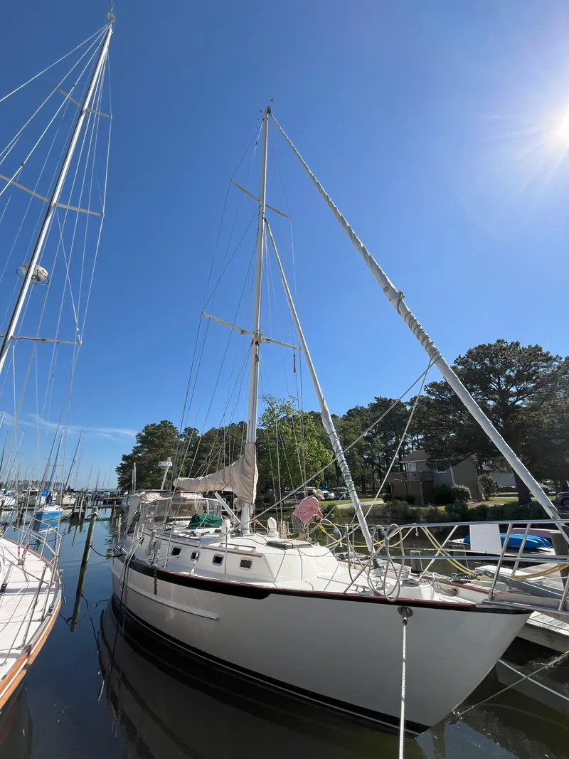 Slide: The Image of 1998 Pacific Seacraft 40 sailboat docked in sunny marina. - 2