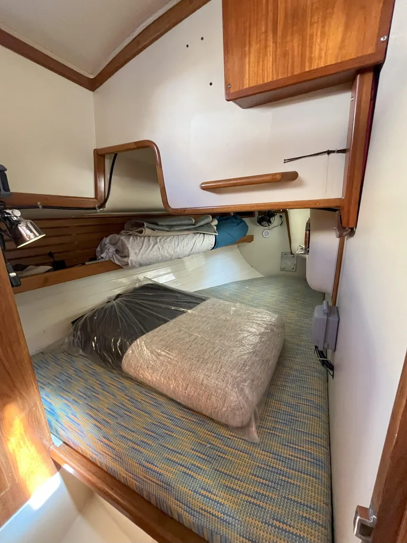 Slide: The Image of Interior of a 1998 Pacific Seacraft 40 yacht with cozy sleeping area. - 20