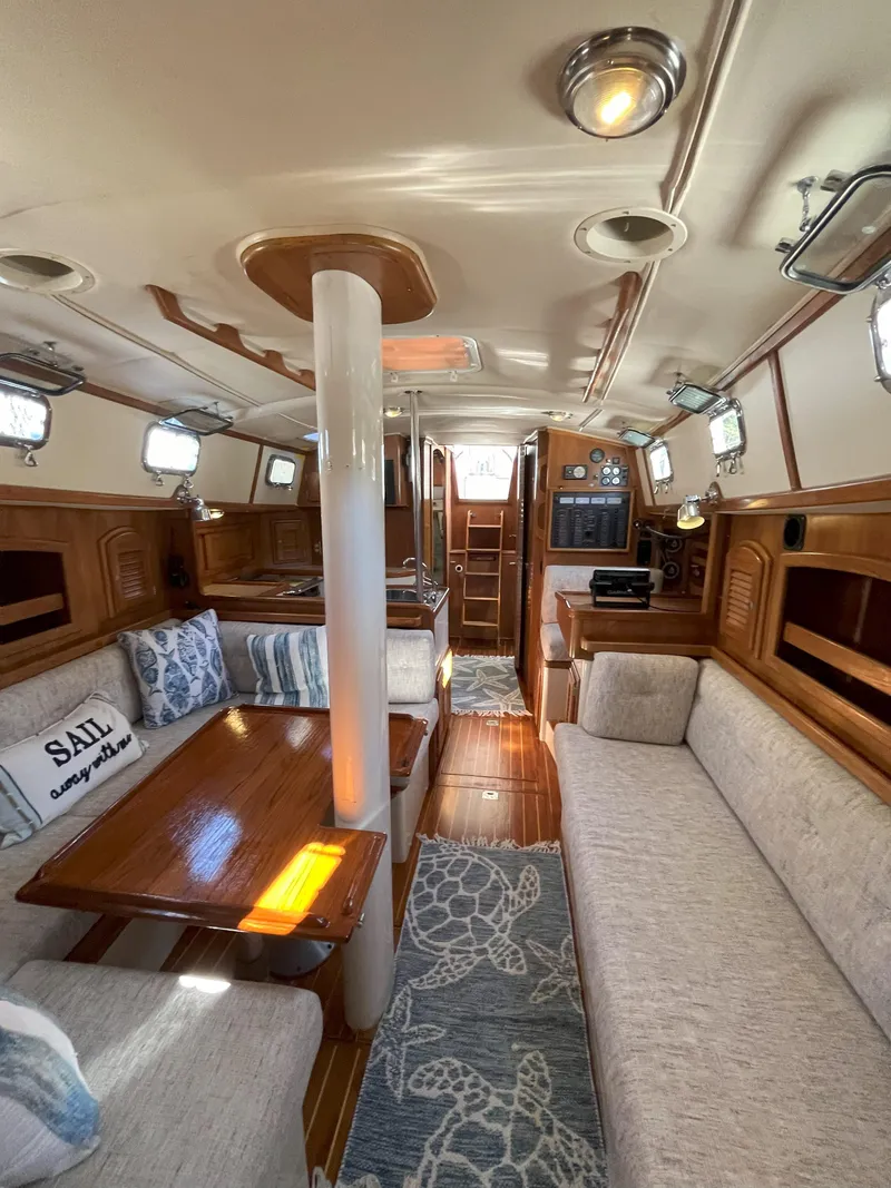 Slide: The Image of Interior of a 1998 Pacific Seacraft 40 yacht, cozy and well-lit. - 24