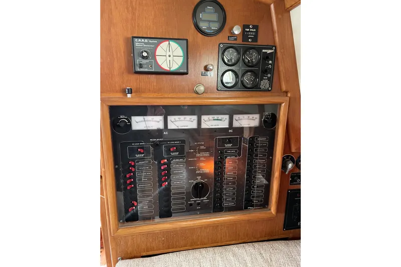 Slide: The Image of Electrical control panel on a 1998 Pacific Seacraft 40 sailboat, featuring AC and DC systems. - 30