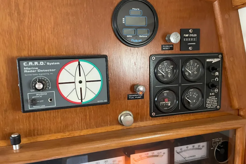Slide: The Image of Control panel of a 1998 Pacific Seacraft 40 with radar detector and gauges. - 31
