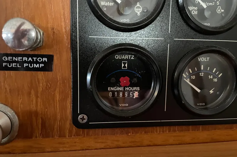 Slide: The Image of Engine hour meter and volt gauge on 1998 Pacific Seacraft 40 yacht. - 32