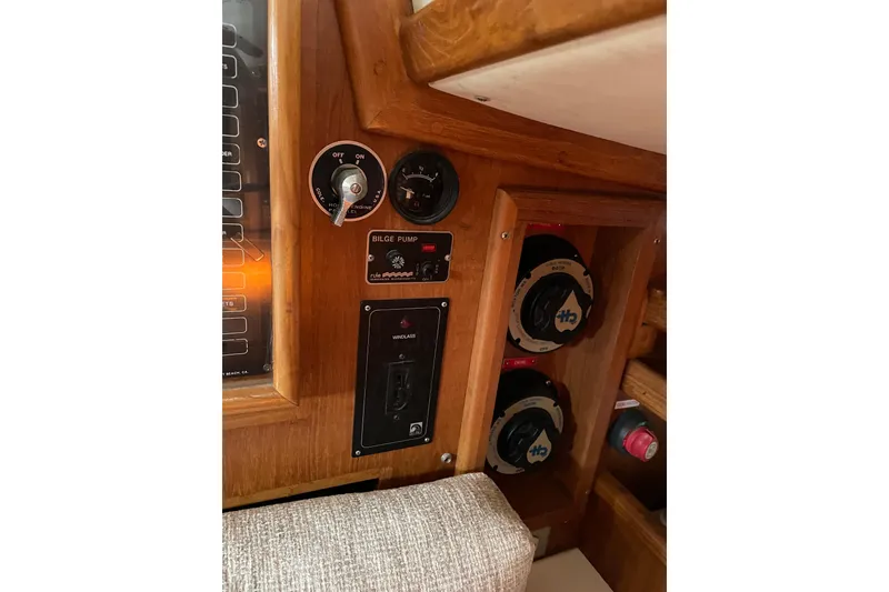 Slide: The Image of Control panel of 1998 Pacific Seacraft 40 sailboat with bilge pump and switches. - 35