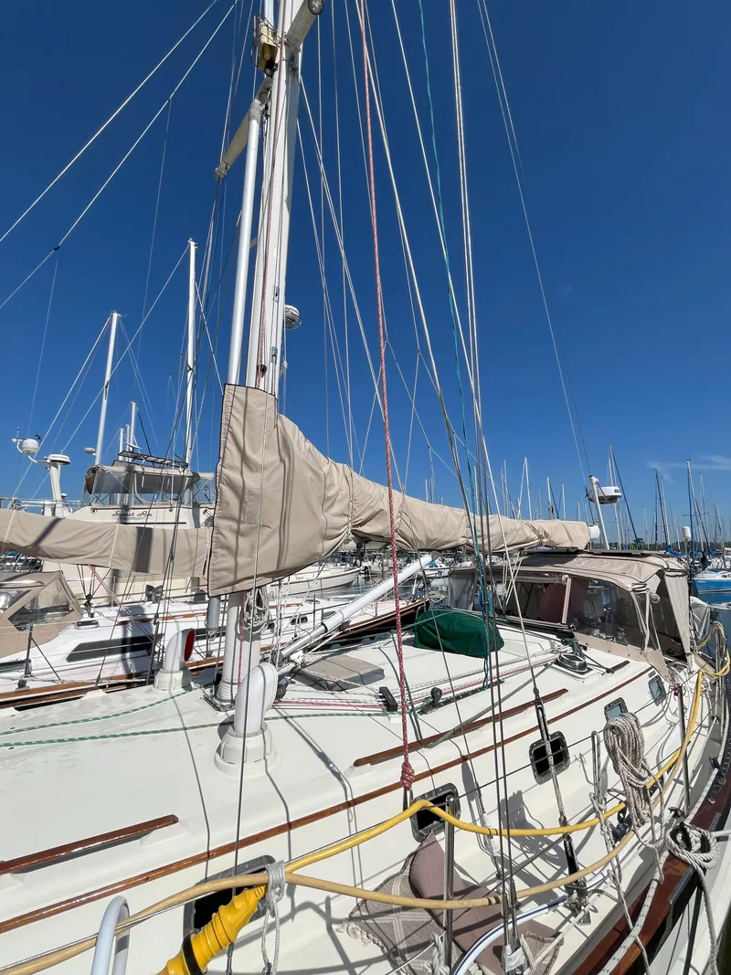 Slide: The Image of 1998 Pacific Seacraft 40 sailboat docked in marina. - 7