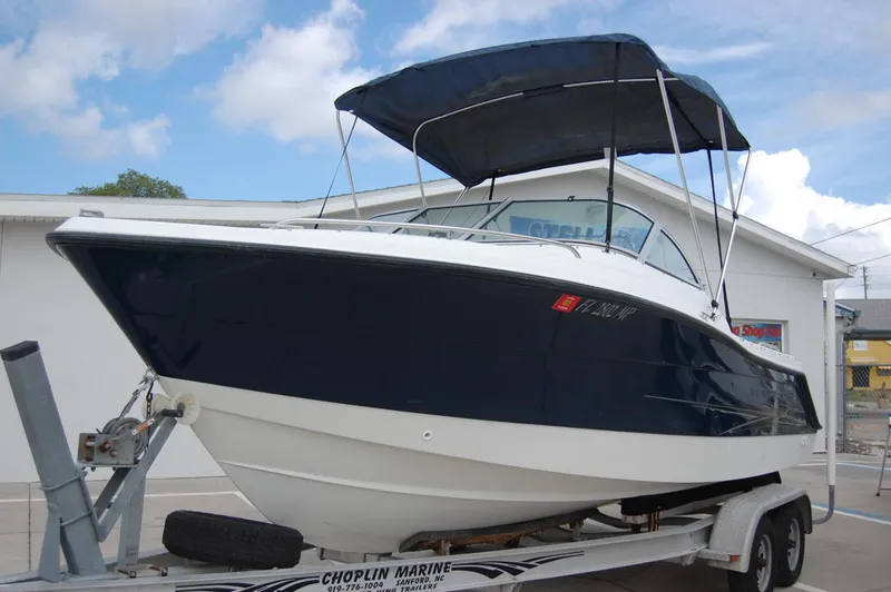 Slide: The Image of 2004 Hydra-Sports Lightning 202 DC boat on trailer with blue canopy. - 3