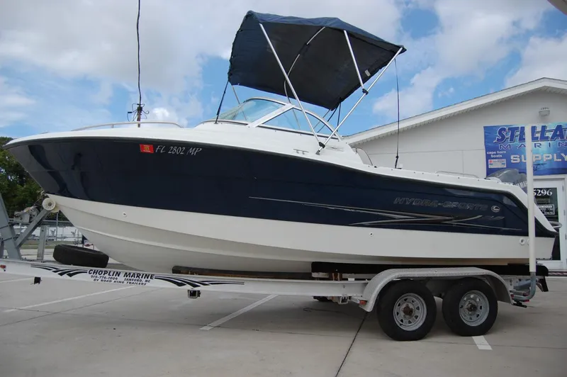 Slide: The Image of 2004 Hydra-Sports Lightning 202 DC boat on a trailer with a blue canopy. - 4
