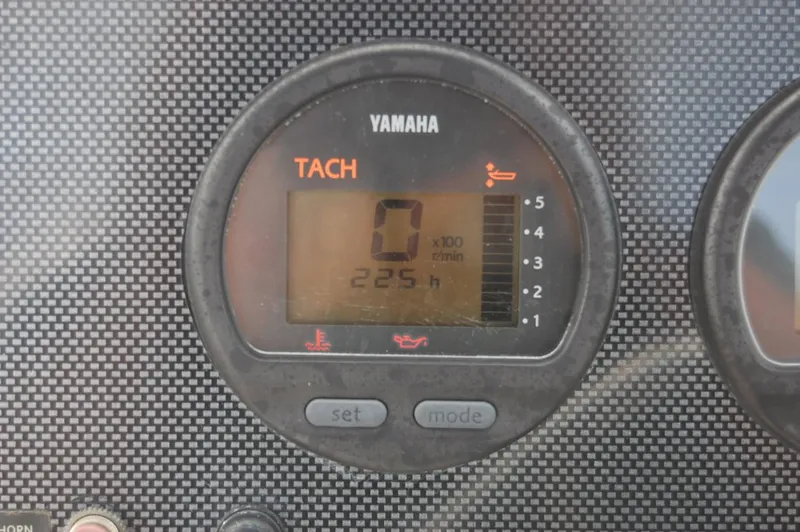 Slide: The Image of Yamaha tachometer on 2004 Hydra-Sports Lightning 202 DC boat dashboard. - 8