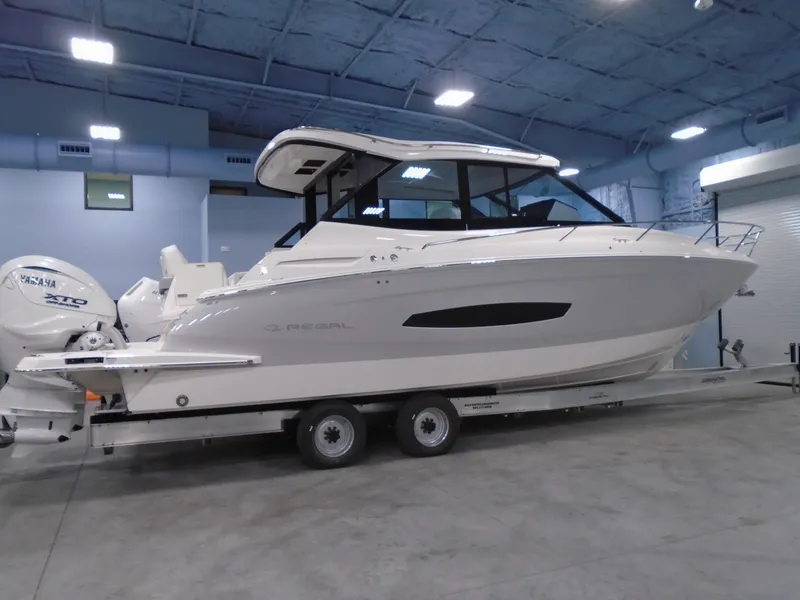 The Image of 2024 Regal 36XO boat on trailer in indoor storage facility. - 0