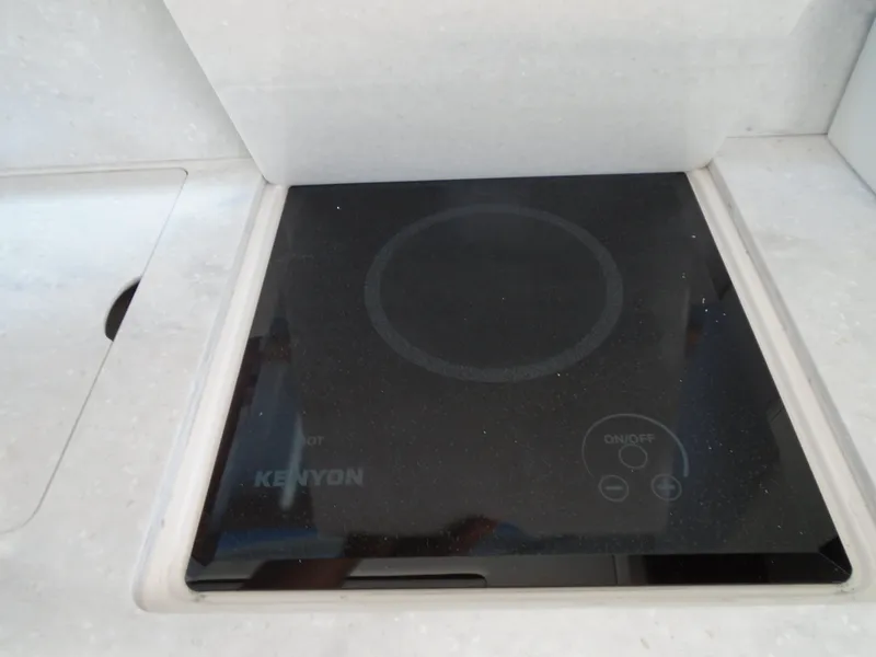 Slide: The Image of Built-in Kenyon cooktop on 2024 Regal 36XO yacht. - 14