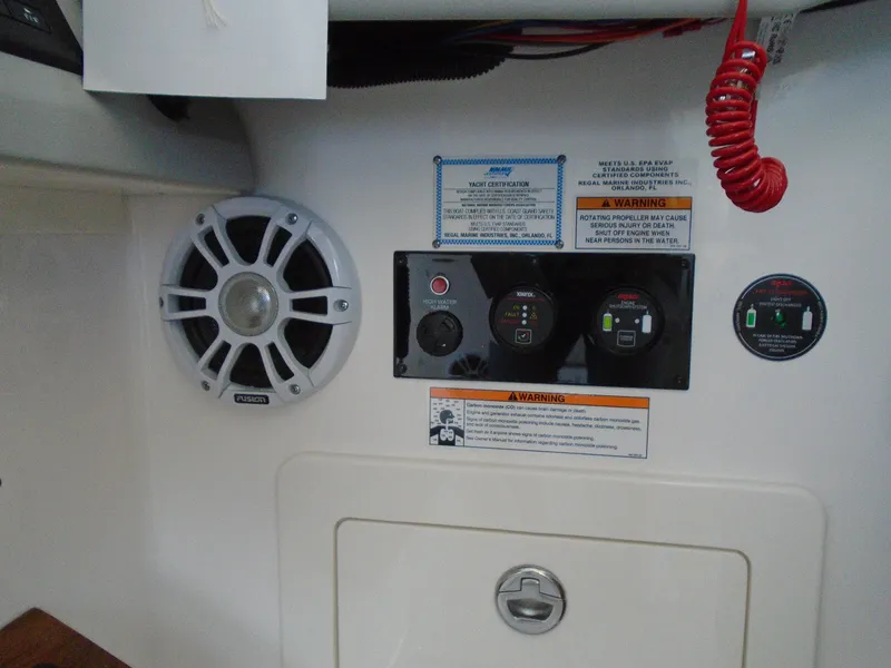 Slide: The Image of Control panel and speaker on a 2024 Regal 36XO boat. - 17