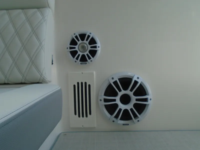 Slide: The Image of Speakers and vent on 2024 Regal 36XO boat interior. - 21