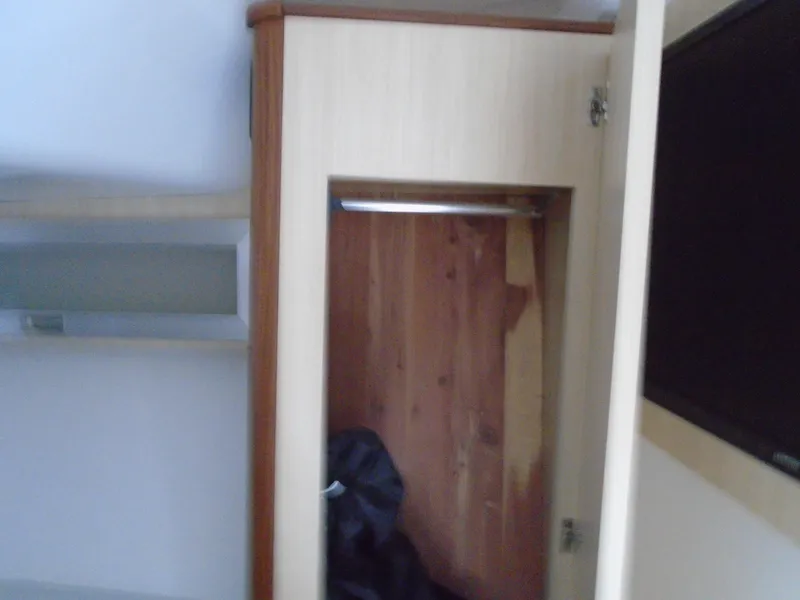 Slide: The Image of 2024 Regal 36XO yacht interior closet and storage space - 23