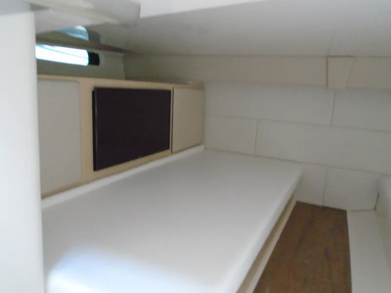 Slide: The Image of 2024 Regal 36XO cabin interior with bed and TV. - 33