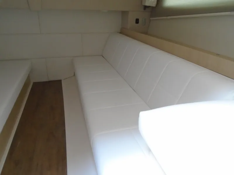 Slide: The Image of 2024 Regal 36XO interior with white leather seating and wooden flooring. - 34