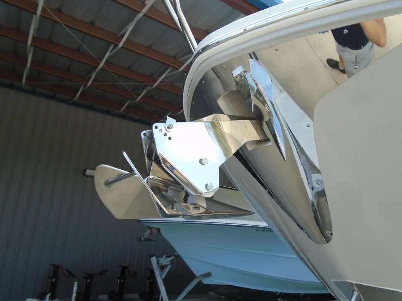 Slide: The Image of Close-up of the 2024 Regal 36XO boat anchor system in a covered storage area. - 39