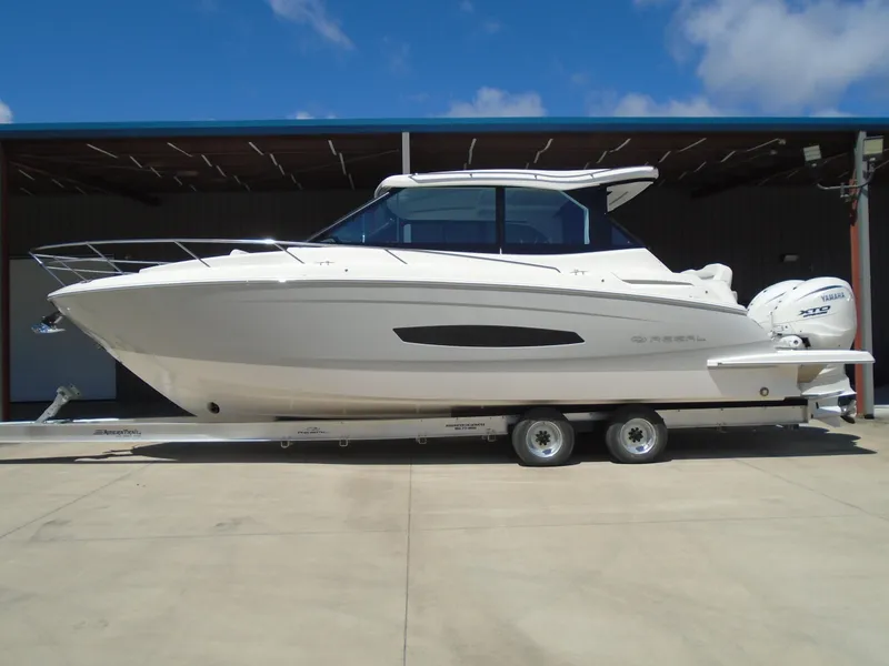 Slide: The Image of 2024 Regal 36XO boat on a trailer, side view. - 4