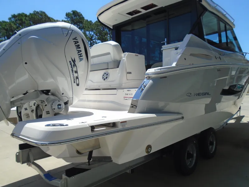 Slide: The Image of 2024 Regal 36XO boat with Yamaha outboard engines on trailer. - 41