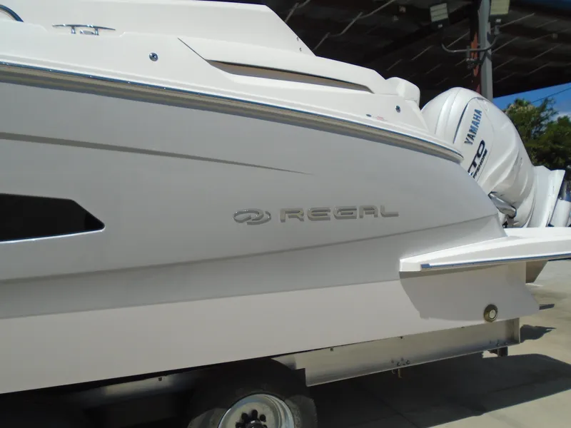 Slide: The Image of 2024 Regal 36XO boat side view with Yamaha outboard motor. - 46
