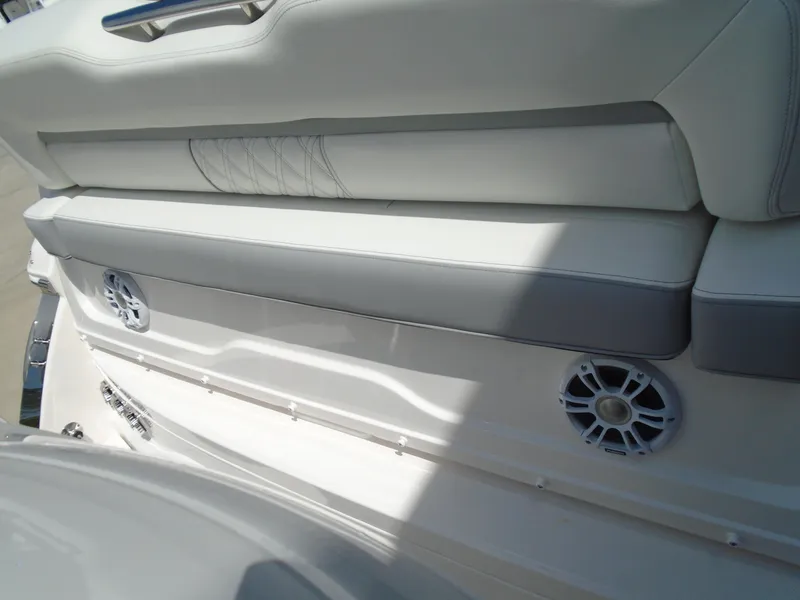 Slide: The Image of 2024 Regal 36XO boat seating area with built-in speakers. - 7