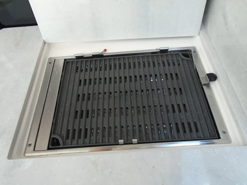 Slide: The Image of Built-in grill on the 2024 Regal 36XO yacht. - 9