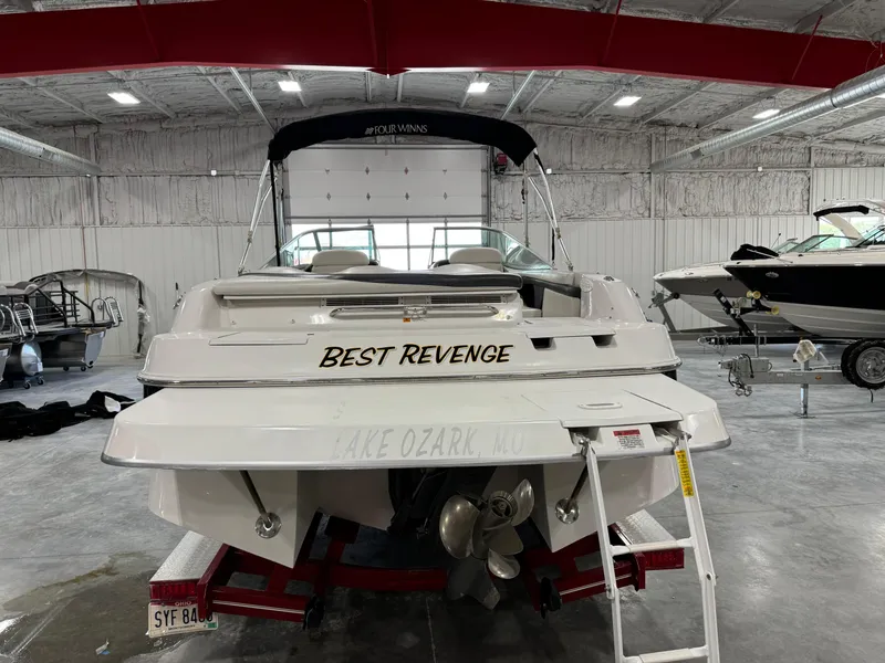 Slide: The Image of 2002 Four Winns 260 Horizon boat named Best Revenge in indoor storage. - 4