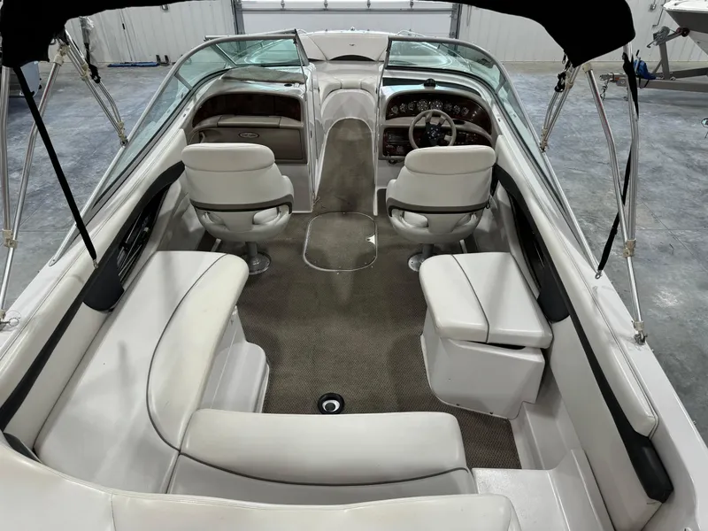 Slide: The Image of 2002 Four Winns 260 Horizon boat interior with seating and dashboard. - 6