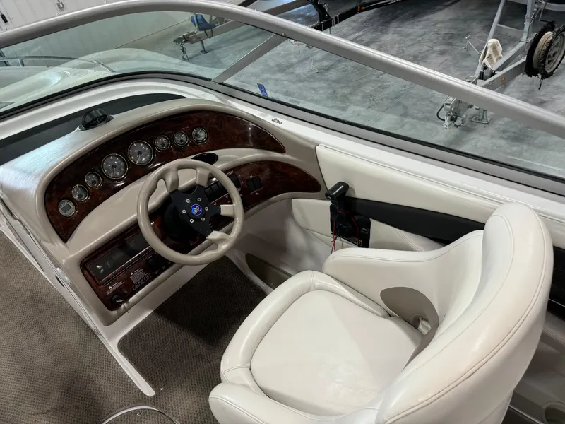 Slide: The Image of 2002 Four Winns 260 Horizon boat cockpit with steering wheel and instrument panel. - 9