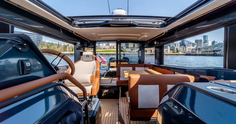 Slide: The Image of Interior of 2025 Arksen 30 yacht with luxurious seating and city skyline view. - 32