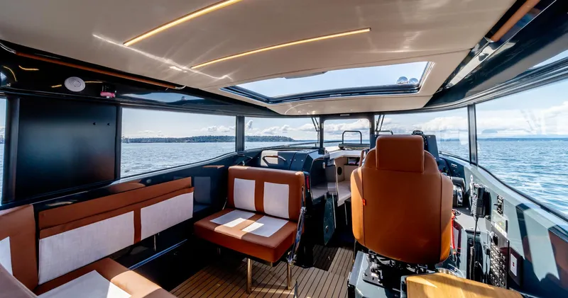 Slide: The Image of Interior of 2025 Arksen 30 yacht with modern seating and panoramic windows. - 36
