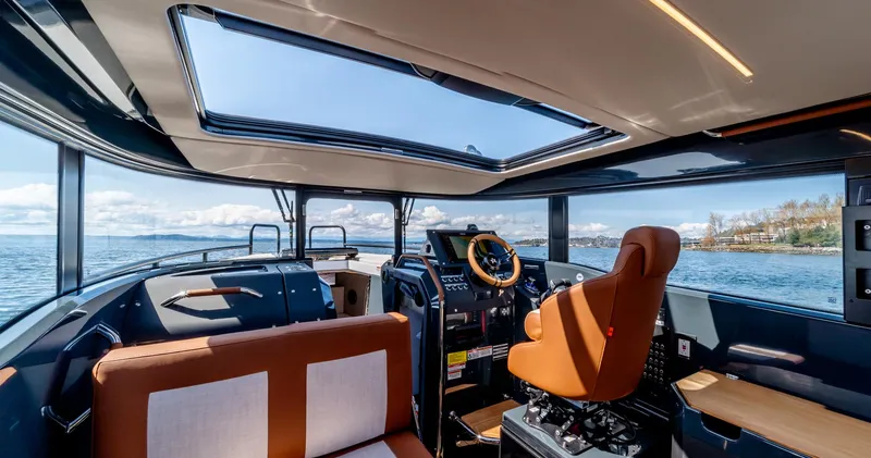 Slide: The Image of Interior of 2025 Arksen 30 boat with panoramic windows and modern helm. - 39