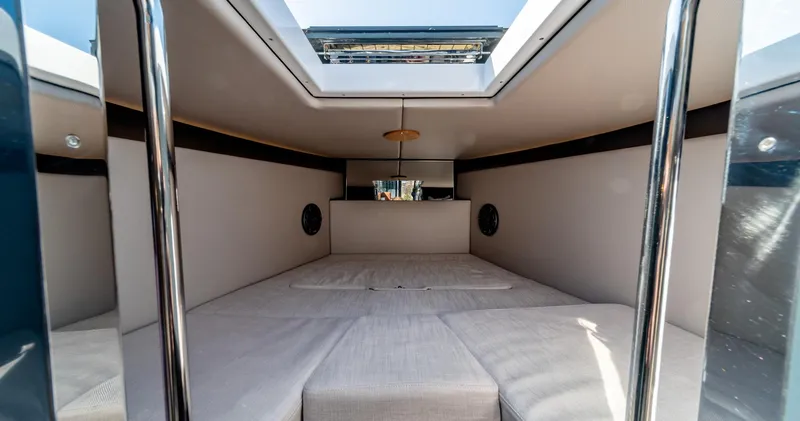 Slide: The Image of Interior cabin of 2025 Arksen 30 boat with skylight and cushioned seating. - 46