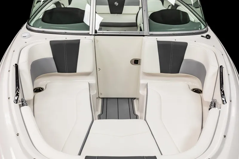 Slide: The Image of 2025 Chaparral 21 Surf boat interior with white and gray seating. - 2