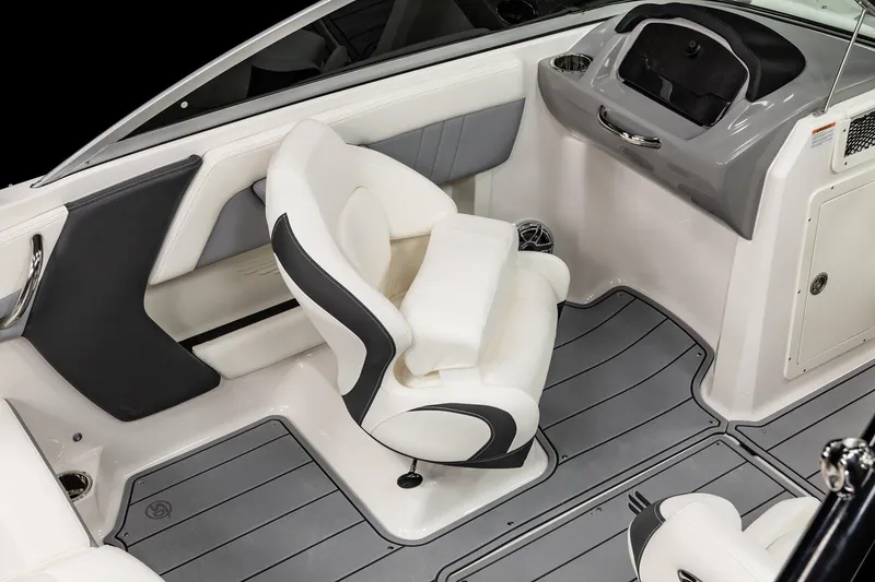 Slide: The Image of 2025 Chaparral 21 Surf boat interior with captain's chair and modern dashboard. - 5