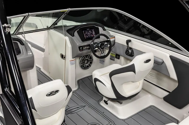 Slide: The Image of 2025 Chaparral 21 Surf boat interior with modern dashboard and seating. - 8